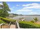 Scenic view from the stairway leading to a private dock and peaceful waterfront at 16108 Woolwine Rd, Charlotte, NC 28278