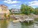 Spectacular waterfront home with a private dock, boat lift, and expansive outdoor living spaces at 16108 Woolwine Rd, Charlotte, NC 28278