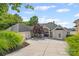 Charming home with a circular driveway, lush landscaping, and a three-car garage at 16108 Woolwine Rd, Charlotte, NC 28278