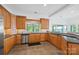 Modern kitchen with granite countertops, stainless steel appliances, and a breakfast bar at 16108 Woolwine Rd, Charlotte, NC 28278