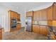 Gourmet kitchen with custom cabinetry, stainless steel appliances, and a tile backsplash at 16108 Woolwine Rd, Charlotte, NC 28278