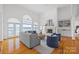 Bright living room with large windows, a fireplace, and views of the water at 16108 Woolwine Rd, Charlotte, NC 28278