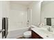Full bathroom with shower-tub combo, vanity with dark wood cabinet and ceramic tile floors at 17204 Caldwell Track Dr, Huntersville, NC 28078