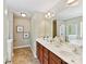 Well-appointed bathroom features dual sinks, a large mirror, and a separate shower and tub for relaxation and convenience at 17204 Caldwell Track Dr, Huntersville, NC 28078