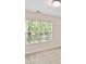 Cozy bedroom featuring large window and neutral walls and carpeting at 17204 Caldwell Track Dr, Huntersville, NC 28078