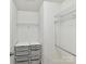 Walk-in closet with plentiful shelving and drawer space perfect for organization and storage at 17204 Caldwell Track Dr, Huntersville, NC 28078
