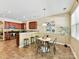 Bright dining area featuring a modern table, stylish seating, and natural light, ideal for casual or formal meals at 17204 Caldwell Track Dr, Huntersville, NC 28078