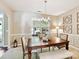 Bright dining room with elegant décor and a large window showcasing the outdoor view at 17204 Caldwell Track Dr, Huntersville, NC 28078