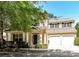 Charming home featuring a welcoming porch, lush landscaping, and a two-car garage at 17204 Caldwell Track Dr, Huntersville, NC 28078