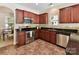 Well-equipped kitchen boasts stainless steel appliances, granite countertops, and ample cabinet space for storage and meal prep at 17204 Caldwell Track Dr, Huntersville, NC 28078