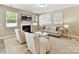 Inviting living room featuring a fireplace, neutral furniture, and soft lighting at 17204 Caldwell Track Dr, Huntersville, NC 28078