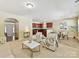 Inviting living room featuring neutral colors, plush seating, and a seamless flow into the adjacent kitchen and dining area at 17204 Caldwell Track Dr, Huntersville, NC 28078