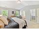 Spacious main bedroom featuring soft carpeting, ample natural light, and a convenient ensuite bathroom and walk-in closet at 17204 Caldwell Track Dr, Huntersville, NC 28078