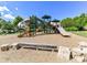 Community playground with multiple slides, climbing structures, and a seating area, providing fun for children at 17204 Caldwell Track Dr, Huntersville, NC 28078