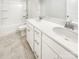 Clean bathroom with a double sink vanity, white cabinets, and a shower-tub combo at 1723 Loggerhead Dr, Lancaster, SC 29720
