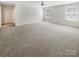 Large bedroom featuring carpeted floors, two windows, and a ceiling fan at 1723 Loggerhead Dr, Lancaster, SC 29720