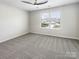 Bright bedroom with a large window and plush carpeting at 1723 Loggerhead Dr, Lancaster, SC 29720