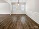 Dining room with hardwood floors, wainscoting, and modern light fixture at 1723 Loggerhead Dr, Lancaster, SC 29720