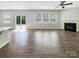 Spacious living area with fireplace, lots of light, and sliding glass doors at 1723 Loggerhead Dr, Lancaster, SC 29720