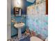 Compact bathroom with pedestal sink, tile floor, and a shower/tub combo at 208 N 5Th St, Albemarle, NC 28001