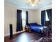 Comfortable bedroom featuring hardwood floors, a window, and space for your personal touch at 208 N 5Th St, Albemarle, NC 28001