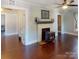 Cozy living room features hardwood floors, a fireplace, and neutral paint at 208 N 5Th St, Albemarle, NC 28001