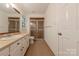Bathroom with neutral tile flooring, sink vanity with drawers, and glass shower at 2310 Vestry Pl, Charlotte, NC 28270