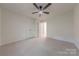 Bright bedroom featuring a ceiling fan and closet at 2310 Vestry Pl, Charlotte, NC 28270