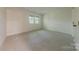 Spacious bedroom with plush carpet, and large window providing natural light at 2310 Vestry Pl, Charlotte, NC 28270