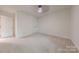 Carpeted bedroom with ceiling fan and closet for ample storage at 2310 Vestry Pl, Charlotte, NC 28270