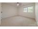 Bedroom with neutral carpet, fan, double window and natural lighting at 2310 Vestry Pl, Charlotte, NC 28270