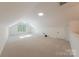 Large bonus room with neutral carpeting, skylights, and recessed lighting at 2310 Vestry Pl, Charlotte, NC 28270