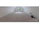 Large bonus room with neutral carpeting, skylights, and recessed lighting at 2310 Vestry Pl, Charlotte, NC 28270