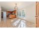 Bright breakfast area featuring tile floors, wood cabinetry, and glass paneled doors to the outdoor patio at 2310 Vestry Pl, Charlotte, NC 28270