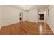 Bright dining room with hardwood floors and classic chandelier lighting at 2310 Vestry Pl, Charlotte, NC 28270
