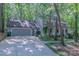 A beautiful two-story home featuring an attached garage and surrounded by mature trees at 2310 Vestry Pl, Charlotte, NC 28270