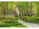 Exterior view of the home showing the beautiful green foliage of trees and bushes at 2310 Vestry Pl, Charlotte, NC 28270