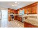 Spacious kitchen features granite countertops, stainless appliances and ample wood cabinet storage at 2310 Vestry Pl, Charlotte, NC 28270