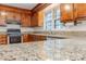 Close up on granite countertops and stainless oven in this traditional home kitchen at 2310 Vestry Pl, Charlotte, NC 28270