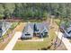Aerial view showcases a home with lush landscaping and a sprawling lawn near a wooded area at 2396 Lee Lawing Rd, Lincolnton, NC 28092