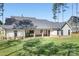 Large backyard with a covered patio, perfect for outdoor entertaining and relaxation at 2396 Lee Lawing Rd, Lincolnton, NC 28092
