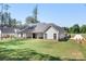 Expansive backyard features lush green lawn, offering ample space for outdoor activities at 2396 Lee Lawing Rd, Lincolnton, NC 28092