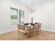 Formal dining room with stylish chandelier, hardwood floors, and plenty of natural light at 2396 Lee Lawing Rd, Lincolnton, NC 28092