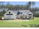 Beautifully landscaped, single-Gathering home with a light grey exterior and black window accents at 2396 Lee Lawing Rd, Lincolnton, NC 28092
