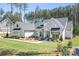 Charming single-Gathering home with a light grey exterior, lovely landscaping, and a luscious green yard at 2396 Lee Lawing Rd, Lincolnton, NC 28092