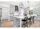 Modern kitchen featuring grey cabinetry, a central island, black pendant lights and updated appliances at 2396 Lee Lawing Rd, Lincolnton, NC 28092