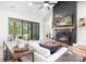 Spacious living room with a black fireplace, natural light, modern decor, and access to the outdoor scenery at 2396 Lee Lawing Rd, Lincolnton, NC 28092