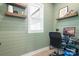 Cozy home office with natural light, built-in shelving, and an organized workspace at 2396 Lee Lawing Rd, Lincolnton, NC 28092