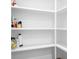 Spacious walk-in pantry with white shelving offers plenty of storage at 2396 Lee Lawing Rd, Lincolnton, NC 28092