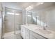 Modern bathroom with a double sink vanity, walk-in shower, and neutral tile at 2405 Hedgecliff Rd, Kannapolis, NC 28025